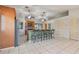 Spacious kitchen with a large island, tile floors, and stainless steel refrigerator at 1219 Michigan N Dr, Dunedin, FL 34698