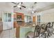 Bright kitchen features a center island with granite countertops, a breakfast bar, and stainless steel appliances at 1219 Michigan N Dr, Dunedin, FL 34698
