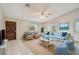 Comfortable living room features stylish furniture, blue accents, and natural light at 1219 Michigan N Dr, Dunedin, FL 34698