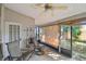 Covered patio with chairs, access to backyard, offering a relaxed outdoor living space at 1219 Michigan N Dr, Dunedin, FL 34698
