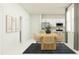 Modern dining area with open kitchen and clean contemporary finishes at 13527 White Gold Run, Parrish, FL 34219