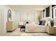 Serene main bedroom with stylish decor, including a patterned rug, a black bench, and natural lighting at 13527 White Gold Run, Parrish, FL 34219