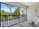 Relax on the balcony with a beautiful view of the canal and lush landscaping at 13602 Frigate Ct # N201, Clearwater, FL 33762