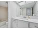 Bright bathroom with large mirror and sink at 13602 Frigate Ct # N201, Clearwater, FL 33762