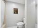 Clean bathroom with toilet and tiled shower and tub combo at 13602 Frigate Ct # N201, Clearwater, FL 33762
