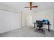 Bedroom with desk and ceiling fan at 13602 Frigate Ct # N201, Clearwater, FL 33762