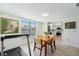 Inviting dining area featuring a window view and open access to the kitchen at 13602 Frigate Ct # N201, Clearwater, FL 33762