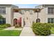 Charming condominium exterior with inviting landscaped entrance and classic architectural details at 13602 Frigate Ct # N201, Clearwater, FL 33762