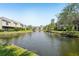 Scenic water view showcasing serene lake and surrounding lush green landscaping at 13602 Frigate Ct # N201, Clearwater, FL 33762