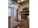Modern kitchen with stainless steel appliances, granite countertops, and tiled backsplash at 14061 Notreville Way, Tampa, FL 33624