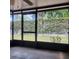 Screened patio offers a relaxing outdoor space with views of the landscaped backyard at 14061 Notreville Way, Tampa, FL 33624