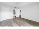 Neutral bedroom with wood-look flooring, ceiling fan, closet, and en-suite bathroom at 14255 Rosemary Ln # 8219, Largo, FL 33774