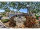 Lakeview of Largo South 55+ community sign with beautiful landscaping and mature trees at 14255 Rosemary Ln # 8219, Largo, FL 33774