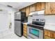Functional kitchen with stainless steel appliances and ample cabinet space at 14255 Rosemary Ln # 8219, Largo, FL 33774