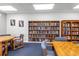 Community library area with extensive bookshelves and comfortable seating at 14255 Rosemary Ln # 8219, Largo, FL 33774