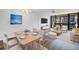 Bright and airy living room with modern furniture, a large sliding door, and contemporary decor at 14255 Rosemary Ln # 8219, Largo, FL 33774