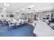 Large multipurpose room with ample tables and chairs for various activities at 14255 Rosemary Ln # 8219, Largo, FL 33774