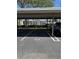 Assigned covered parking spot number 37 in front of a lush landscaped apartment complex at 14255 Rosemary Ln # 8219, Largo, FL 33774