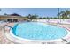 Large community pool with lounge chairs and well-maintained surrounding area at 14255 Rosemary Ln # 8219, Largo, FL 33774