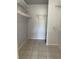 Spacious walk-in closet featuring wire shelving and neutral tile flooring for easy organization at 14255 Rosemary Ln # 8219, Largo, FL 33774