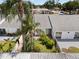 Aerial view of condo with private fenced-in yard, lush greenery, and updated roof at 1655 S Highland Ave # C155, Largo, FL 33756