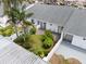 Aerial view of a condo featuring a private courtyard, landscaped grounds, and a sunny disposition at 1655 S Highland Ave # C155, Largo, FL 33756