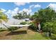 Private backyard oasis featuring lush landscaping and a hammock at 1655 S Highland Ave # C155, Largo, FL 33756