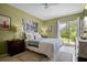 Calm bedroom featuring soft decor, outside views, and a serene, comfortable space at 1655 S Highland Ave # C155, Largo, FL 33756