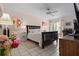 Comfortable bedroom with soft lighting, ceiling fan, and a serene ambiance for restful sleep at 1655 S Highland Ave # C155, Largo, FL 33756