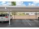 Assigned covered parking with a white fence in the background at 1655 S Highland Ave # C155, Largo, FL 33756