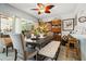 Cozy dining room with a ceiling fan, perfect for Gathering meals and gatherings at 1655 S Highland Ave # C155, Largo, FL 33756