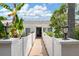 Inviting condo exterior with well-maintained landscaping and a pathway leading to the entrance at 1655 S Highland Ave # C155, Largo, FL 33756