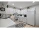 Efficiently designed kitchen with white appliances, ample counter space, and practical storage solutions at 1655 S Highland Ave # C155, Largo, FL 33756
