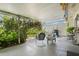 Covered patio featuring comfortable seating, plants, and a garden view, perfect for relaxation at 1655 S Highland Ave # C155, Largo, FL 33756