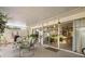 Covered patio with sliding glass doors that open to the house at 1655 S Highland Ave # C155, Largo, FL 33756