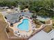 Aerial view of the community pool and shuffleboard courts at 1655 S Highland Ave # C155, Largo, FL 33756