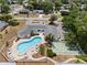 Aerial view of the community pool and shuffleboard courts at 1655 S Highland Ave # C155, Largo, FL 33756
