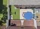 Aerial shot highlighting the backyard's patio, lawn, trampoline, and well-maintained landscaping at 1725 Sommarie Way, Tarpon Springs, FL 34689