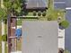Aerial view showcasing the well-maintained backyard with patio, lawn, and privacy fencing at 1725 Sommarie Way, Tarpon Springs, FL 34689