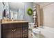 Bathroom featuring a vanity, toilet and bathtub at 1725 Sommarie Way, Tarpon Springs, FL 34689