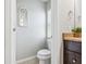 Neat bathroom with toilet and vanity at 1725 Sommarie Way, Tarpon Springs, FL 34689