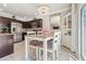 Inviting dining area with a chandelier, modern table setting, and views of kitchen appliances at 1725 Sommarie Way, Tarpon Springs, FL 34689