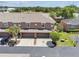 Aerial view of a multi-Gathering home with a brown roof and a driveway at 1725 Sommarie Way, Tarpon Springs, FL 34689