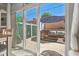 View of private patio area with stylish outdoor furniture and brick pavers at 1725 Sommarie Way, Tarpon Springs, FL 34689