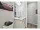 Bathroom with a light grey painted wall and a large mirror above the sink at 17652 Ramble On Way, Land O Lakes, FL 34638
