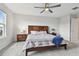 Bright bedroom featuring a wooden headboard, neutral color palette, and plenty of natural light at 17652 Ramble On Way, Land O Lakes, FL 34638