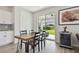 Bright dining area with table, chairs, and sliding glass doors leading to the backyard patio at 17652 Ramble On Way, Land O Lakes, FL 34638
