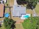 Aerial view of a home featuring two private pools, a fenced yard, and mature trees at 2204 Jennifer Ln, Valrico, FL 33594