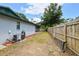 Backyard featuring a lawn area, fenced perimeter, and exterior of the home's structure at 2204 Jennifer Ln, Valrico, FL 33594