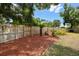 Fenced backyard with lush greenery, providing privacy and a serene atmosphere at 2204 Jennifer Ln, Valrico, FL 33594